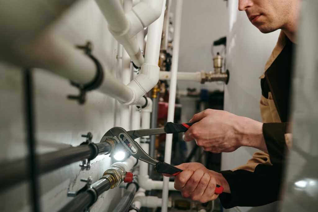 Plumbers maintaining commercial plumbing pipes in Rockledge
