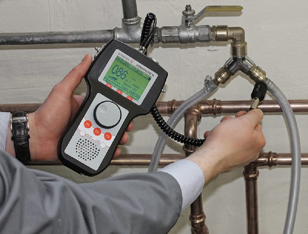 Plumber testing pipes with electronic leak detection equipment in Rockledge