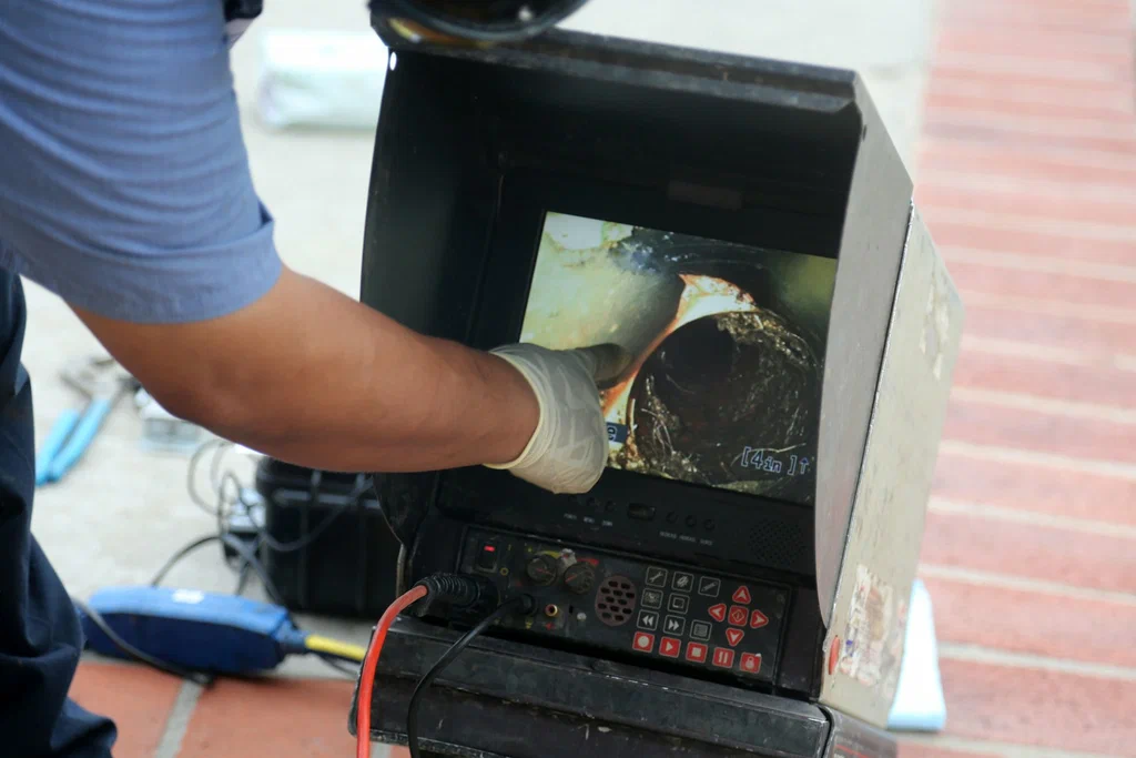 Technician viewing a drain inspection camera in Rockledge
